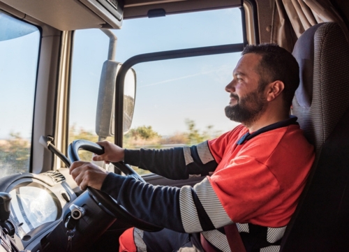 A truck driver smiling