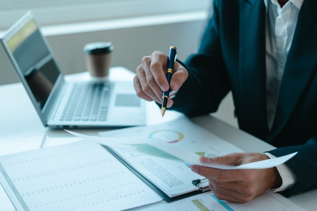 A person bookkeeping and checking stats for an EV fleet